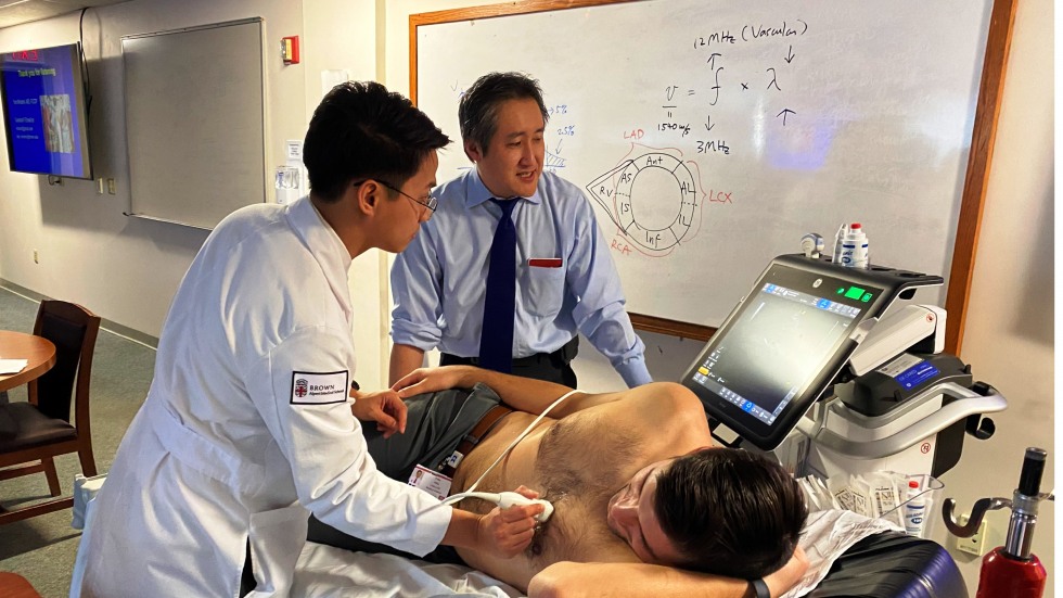 doctor performing chest ultrasound on patient model
