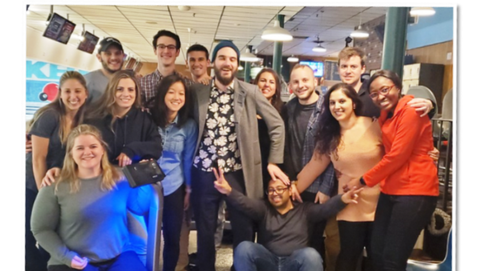 doctors posing for group picture at bowling alley