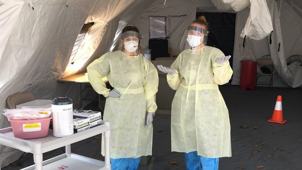 doctors dresses in PPE to test for COVID